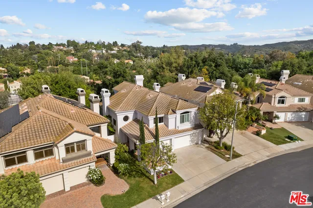 a view of a lake with a house in the background