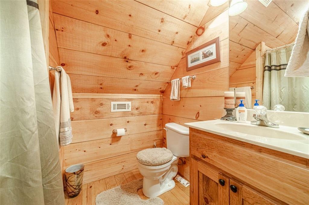 2970 Sky Lake Road Sautee Nacoochee, GA 30571 - Photo 24 of 53 a bathroom with a granite countertop toilet sink and mirror