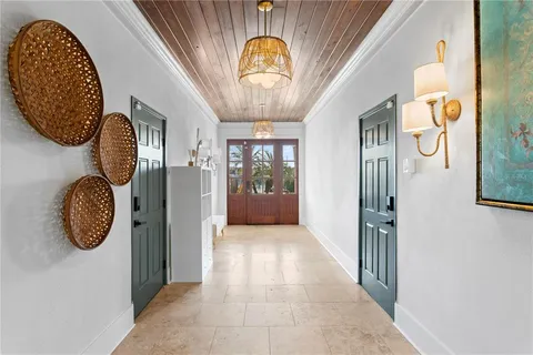 a view of a entryway door front of a house