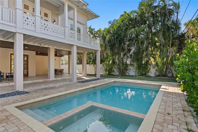a view of a swimming pool with sitting area