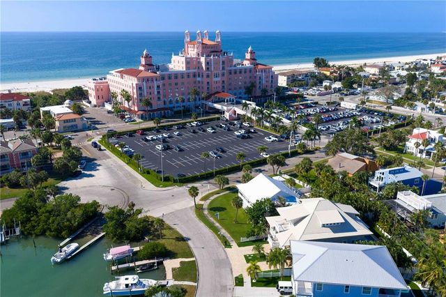 an aerial view of a house with a lake view