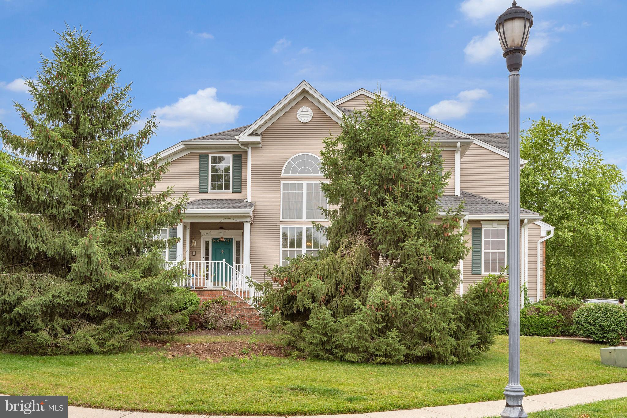 16 Cardiff Court Princeton Junction, NJ 08550 - Photo 4 of 60 a front view of a house with garden