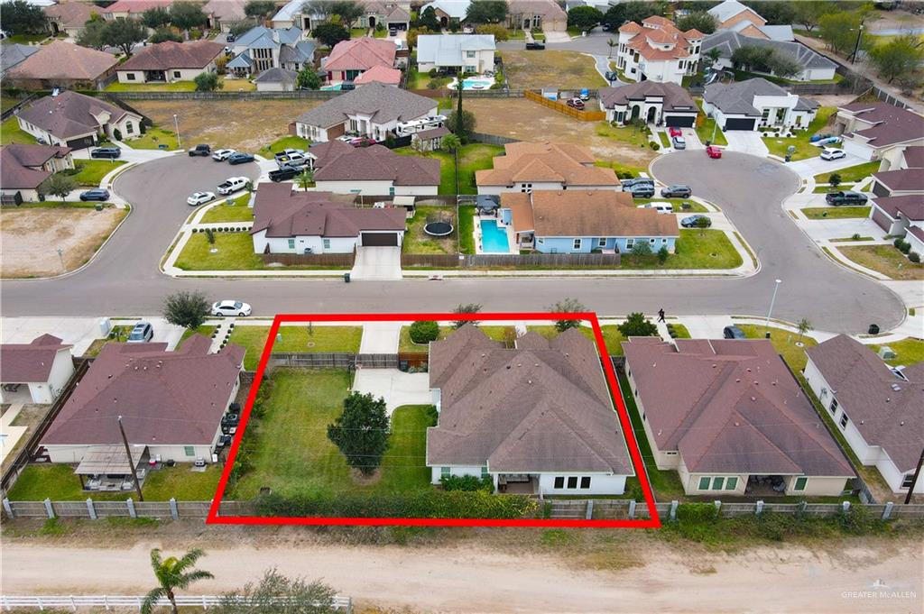 2701 Thompson Street Mission, TX 78573 - Photo 22 of 23 Aerial view of property and surrounding area with nearby suburban area and property parcel outlined