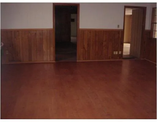 a kitchen with stainless steel appliances granite countertop a sink a stove and a microwave