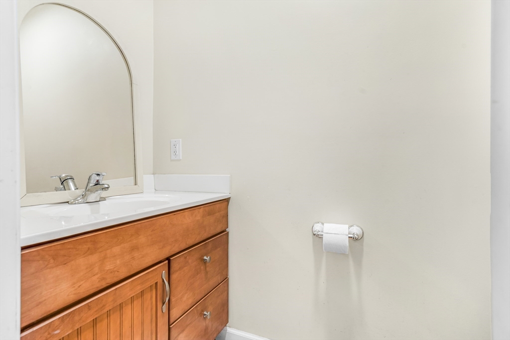 97 Packard Road Stow, MA 01775 - Photo 15 of 31 a bathroom with a sink and a mirror