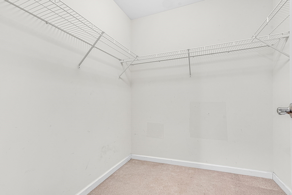 97 Packard Road Stow, MA 01775 - Photo 25 of 31 a view of a room with racks on the wall