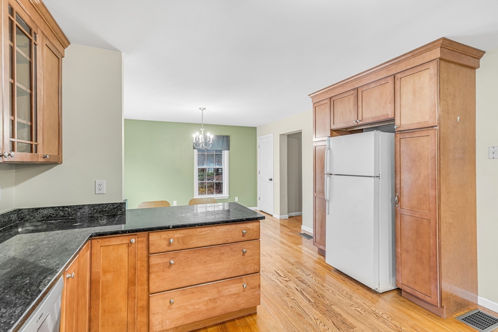 97 Packard Road Stow, MA 01775 - Photo 5 of 31 a view of a kitchen counter space and wooden floor