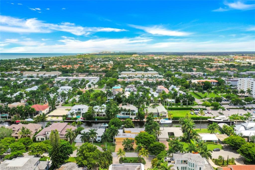 635 15th Avenue South Naples, FL 34102 - Photo 11 of 13 an aerial view of residential houses with outdoor space and trees