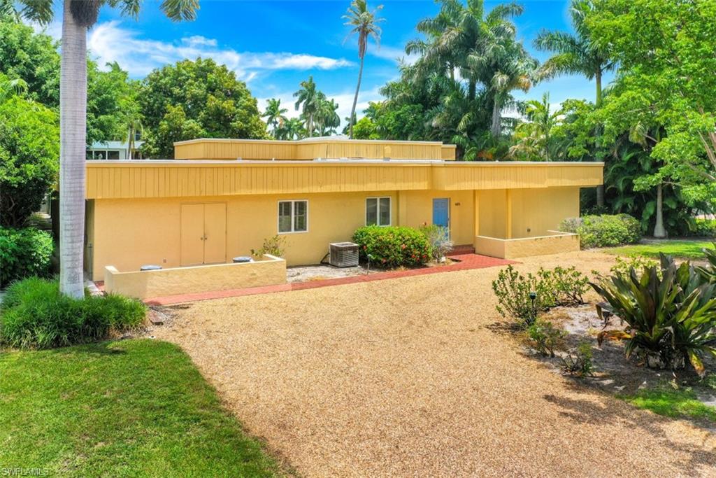 635 15th Avenue South Naples, FL 34102 - Photo 13 of 13 a front view of a house with garden