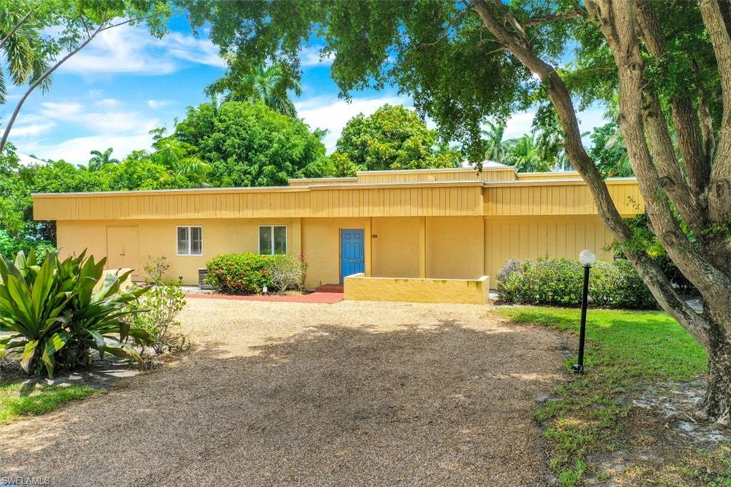 635 15th Avenue South Naples, FL 34102 - Photo 5 of 13 a house view with a backyard space