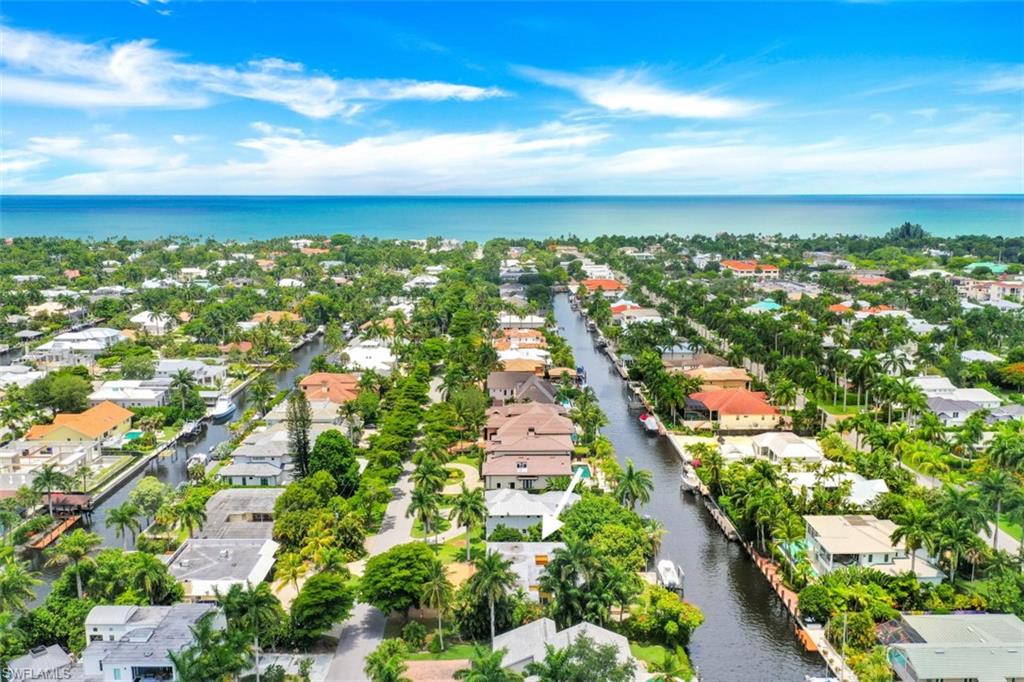 635 15th Avenue South Naples, FL 34102 - Photo 7 of 13 an aerial view of residential houses with outdoor space