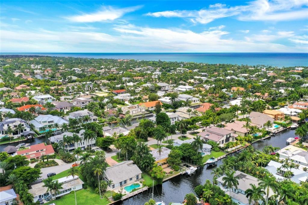 635 15th Avenue South Naples, FL 34102 - Photo 8 of 13 an aerial view of residential houses with city view