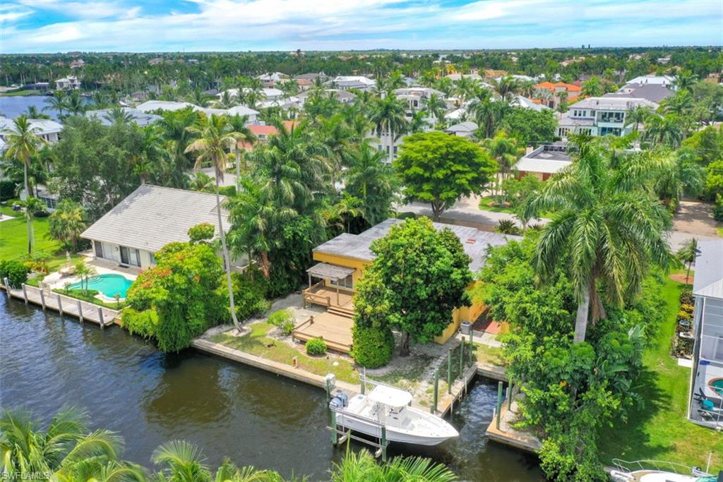 635 15th Avenue South Naples, FL 34102 - Photo 9 of 13 a view of a lake with a house