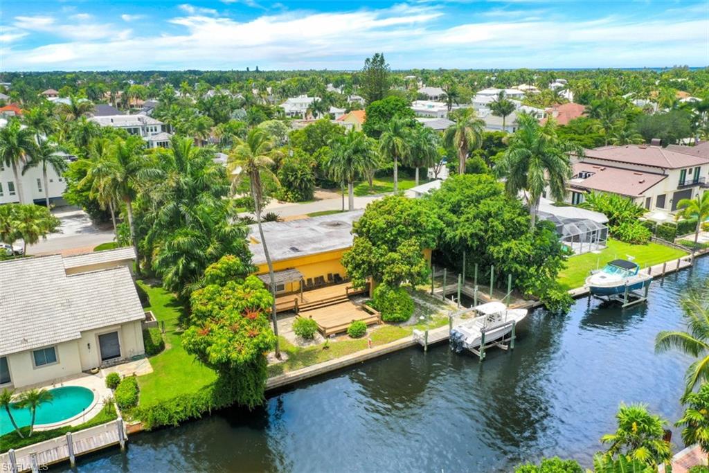 635 15th Avenue South Naples, FL 34102 - Photo 10 of 13 a view of a lake with a house