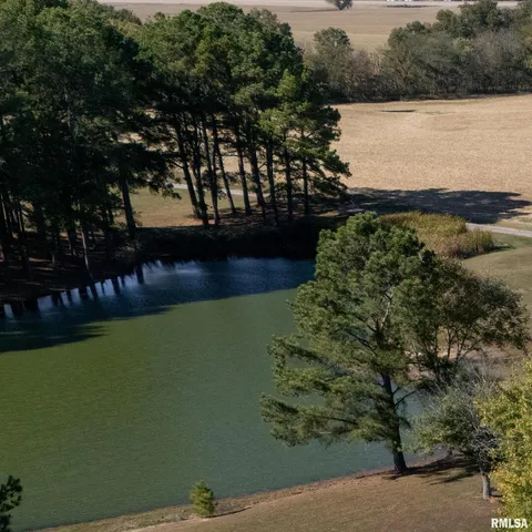 a bedroom with table and chairs