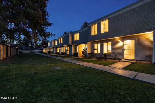 a view of yard with swimming pool and green space