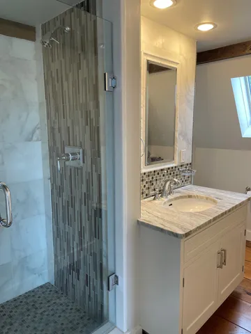 a bathroom with a sink and a mirror