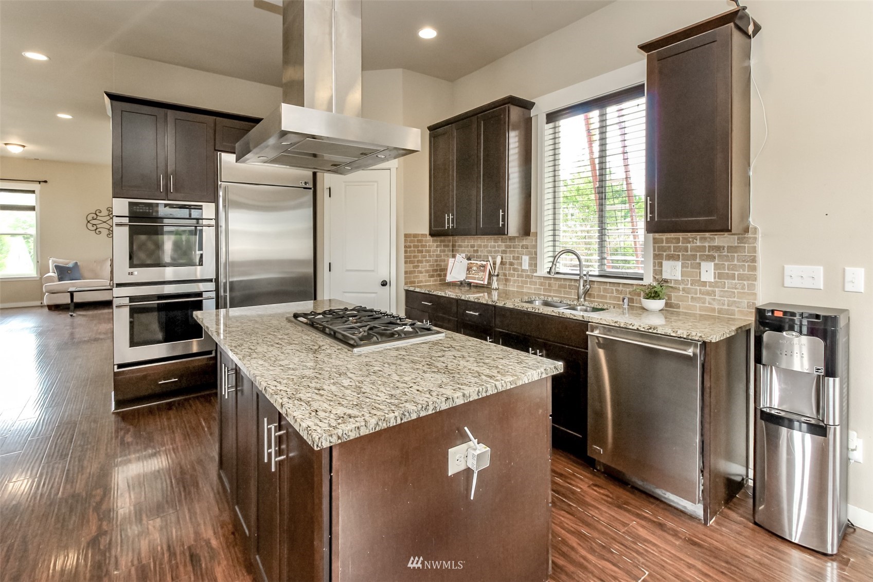 889 Lund Street Buckley, WA 98321 - Photo 11 of 40 a kitchen with a sink stove and refrigerator