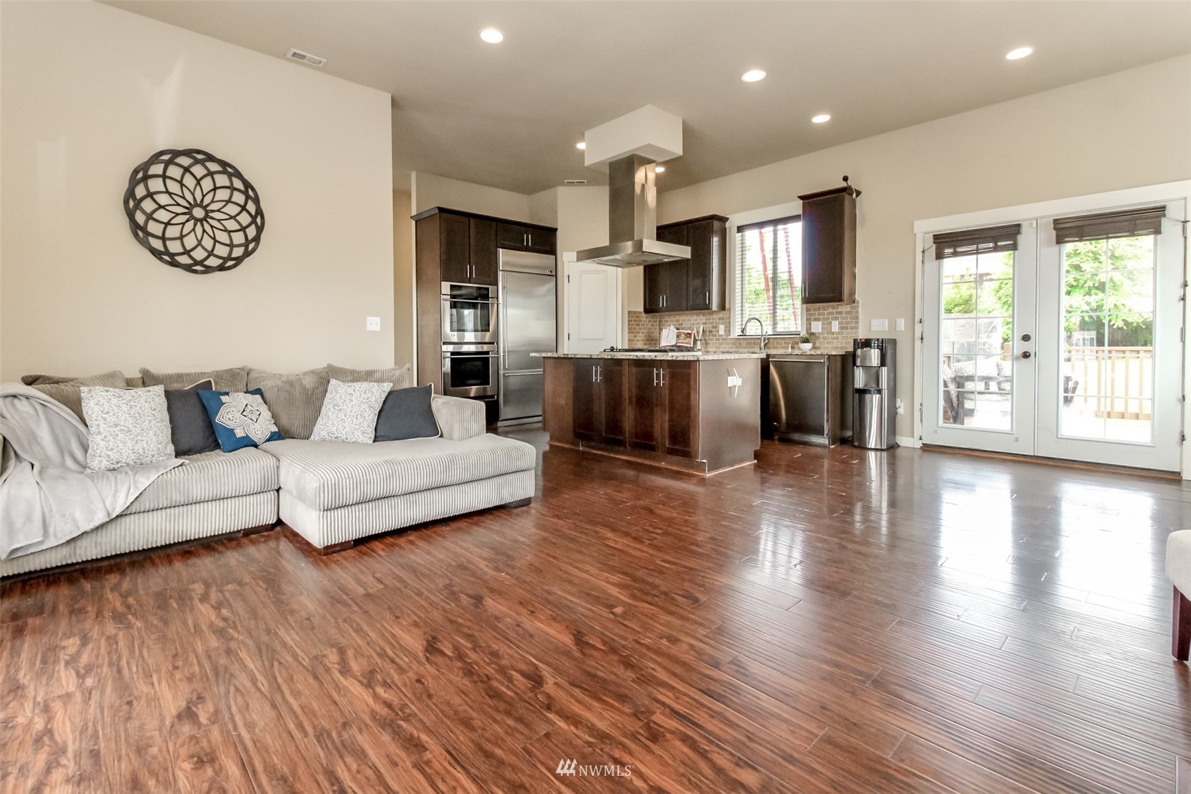 889 Lund Street Buckley, WA 98321 - Photo 19 of 40 a living room with furniture a wooden floor and a large window