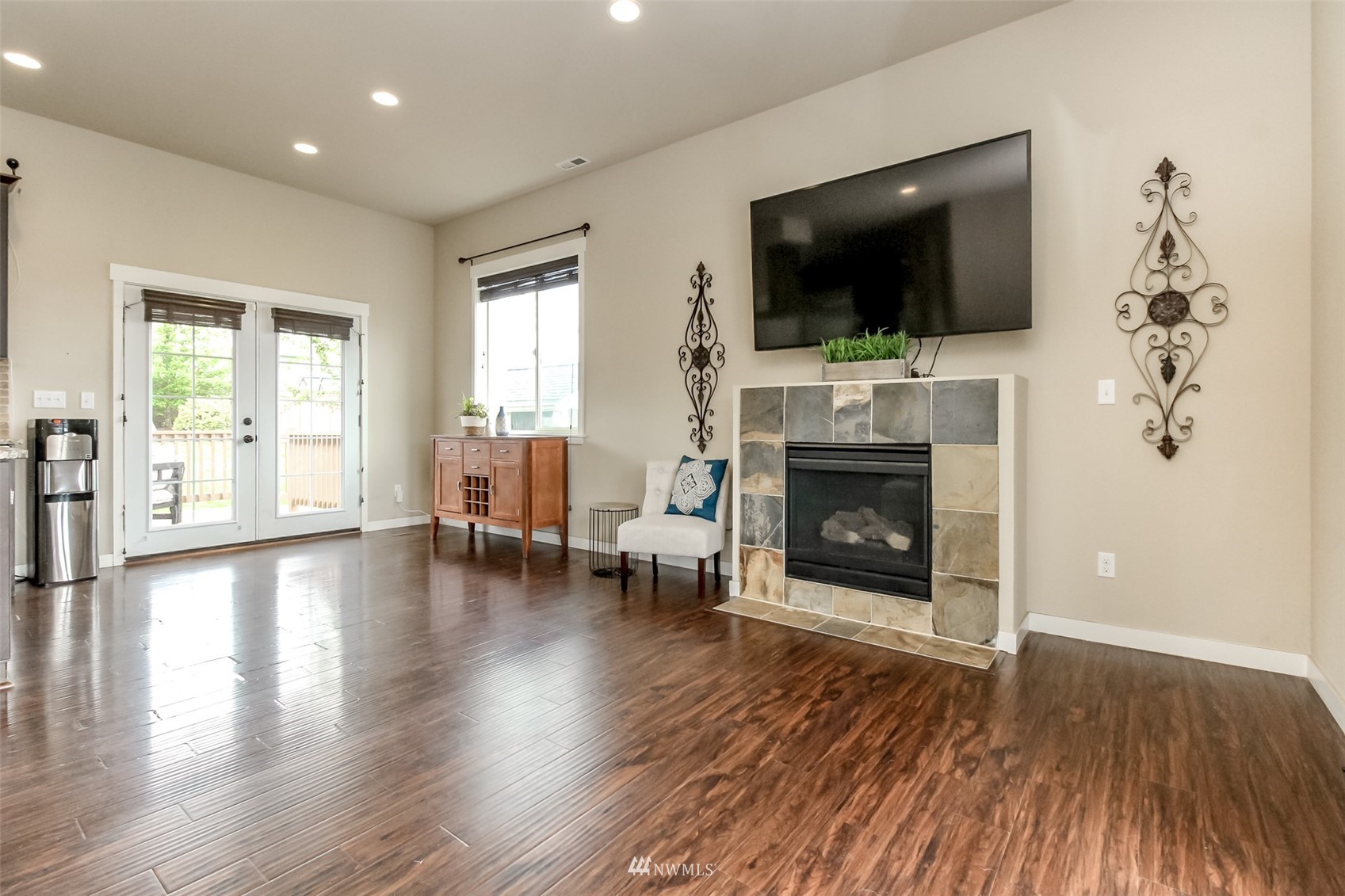 889 Lund Street Buckley, WA 98321 - Photo 20 of 40 a living room with furniture a flat screen tv and a fireplace