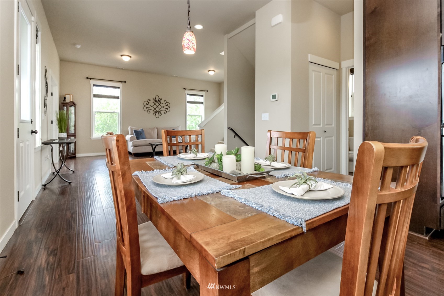889 Lund Street Buckley, WA 98321 - Photo 22 of 40 a view of a dining room with furniture and wooden floor