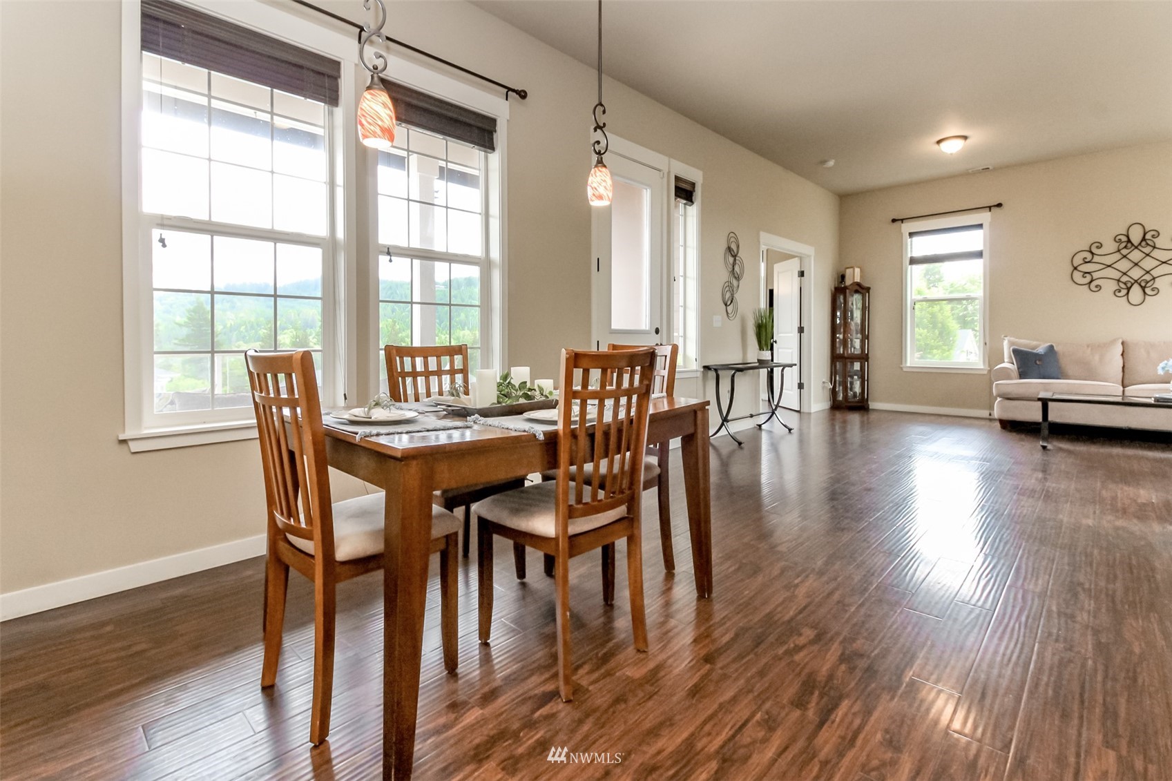 889 Lund Street Buckley, WA 98321 - Photo 23 of 40 a view of a dining room with furniture and wooden floor