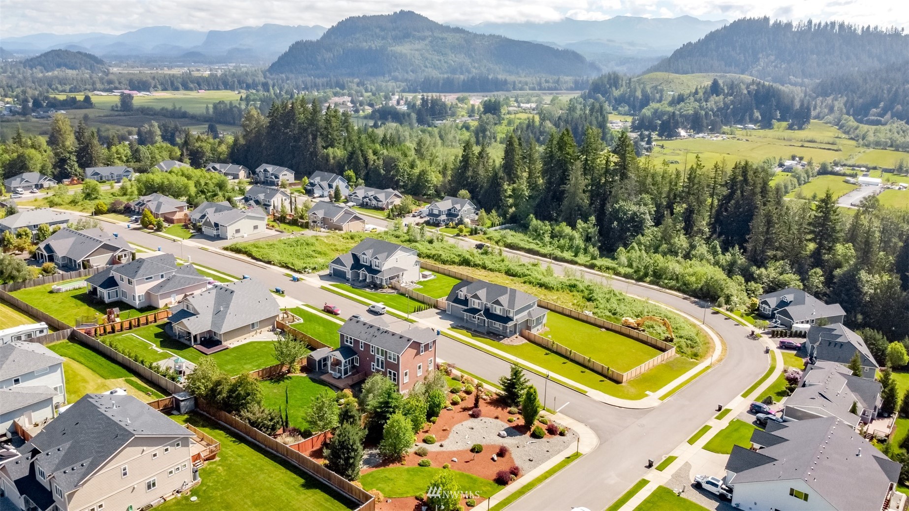 889 Lund Street Buckley, WA 98321 - Photo 3 of 40 an aerial view of residential houses and outdoor space