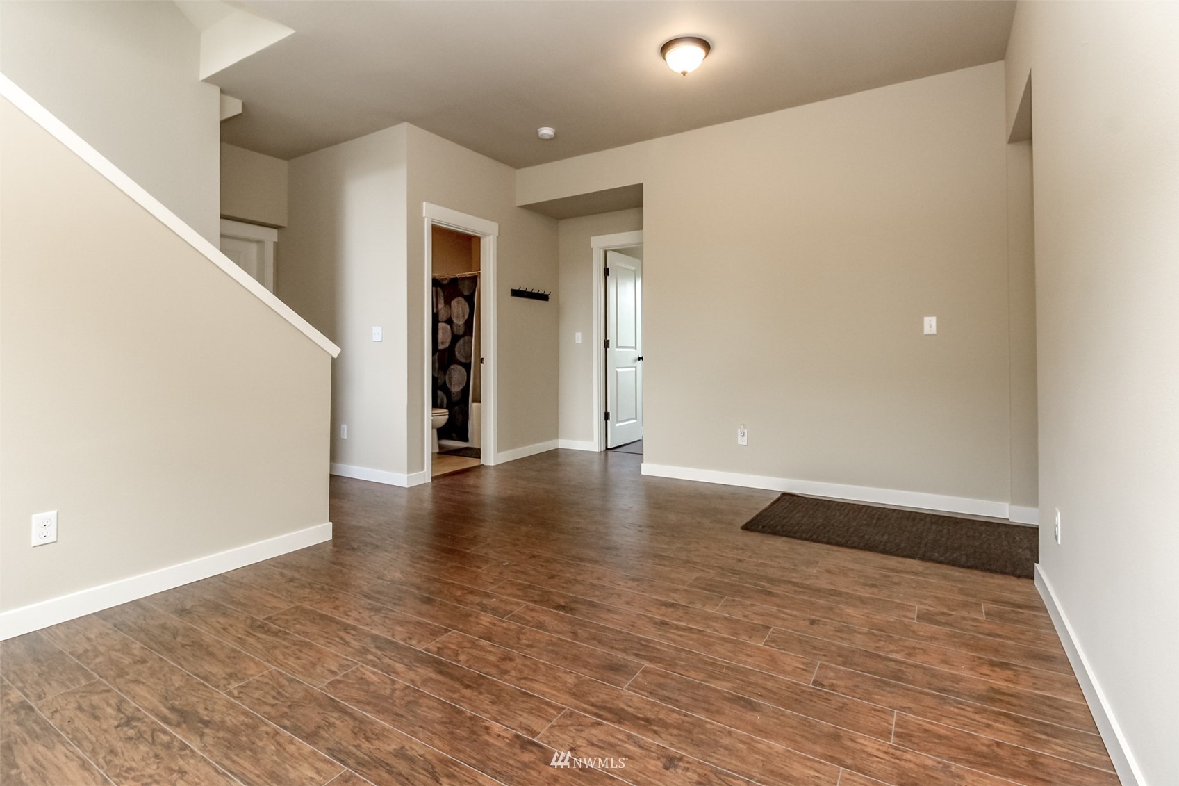 889 Lund Street Buckley, WA 98321 - Photo 31 of 40 a view of an empty room with wooden floor