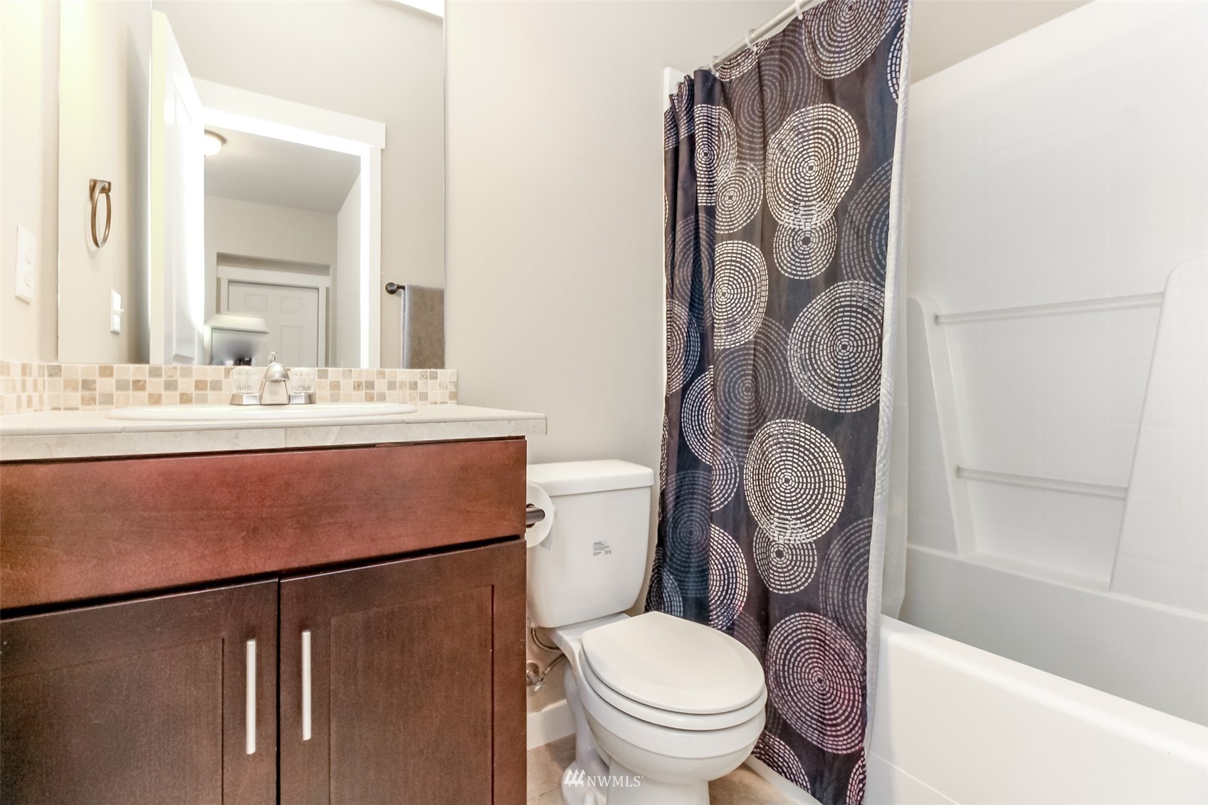 889 Lund Street Buckley, WA 98321 - Photo 32 of 40 a bathroom with a sink mirror vanity and toilet
