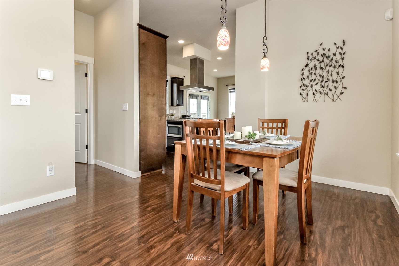 889 Lund Street Buckley, WA 98321 - Photo 10 of 40 a view of a dining room with furniture and wooden floor