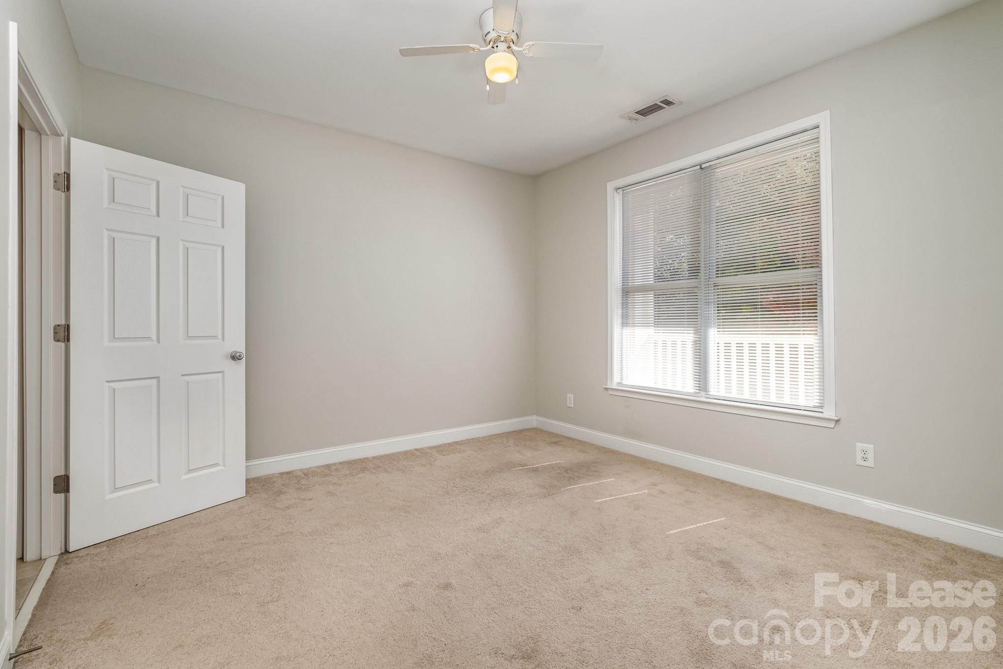 1000 East Woodlawn Road, Unit 201 Charlotte, NC 28209 - Photo 14 of 29 a view of an empty room with a window