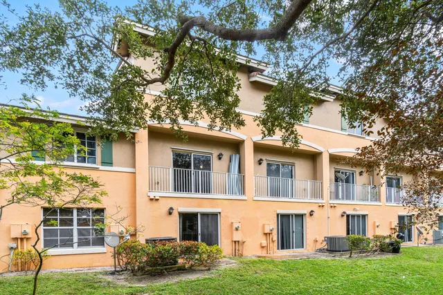 a view of a big yard with large tree