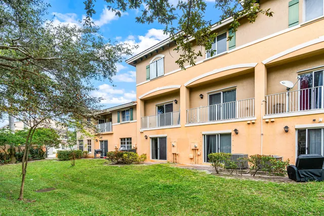 a view of a livingroom with furniture and a floor to ceiling window