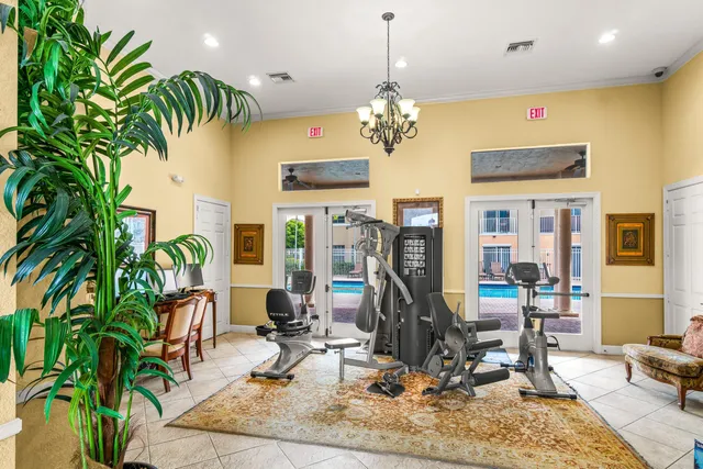 a view of a house with pool and sitting area