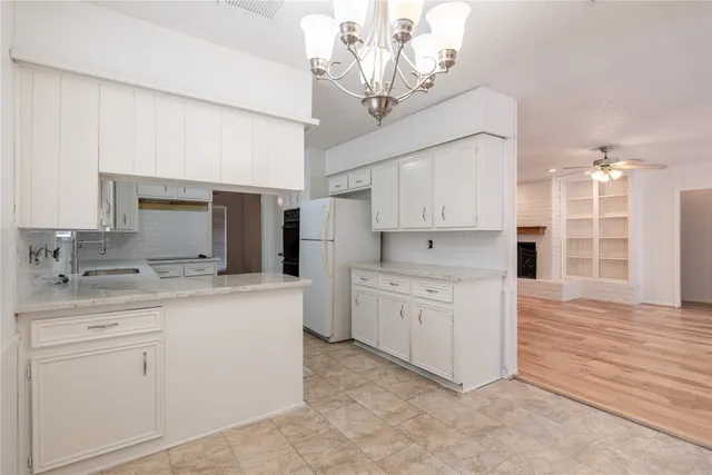 a kitchen with a sink and cabinets