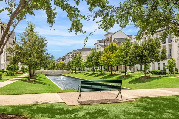 a view of a park with large trees