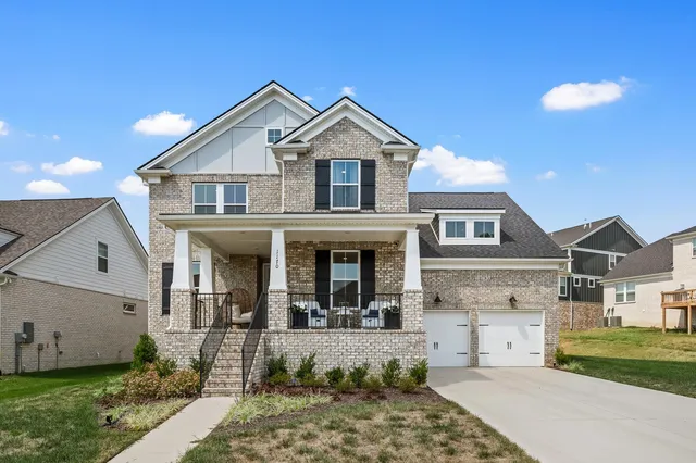 a view of a yard in front of a house
