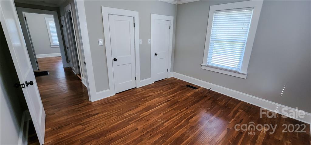 118 Baxter Street Morganton, NC 28655 - Photo 14 of 18 a view of a room with wooden floor and a window