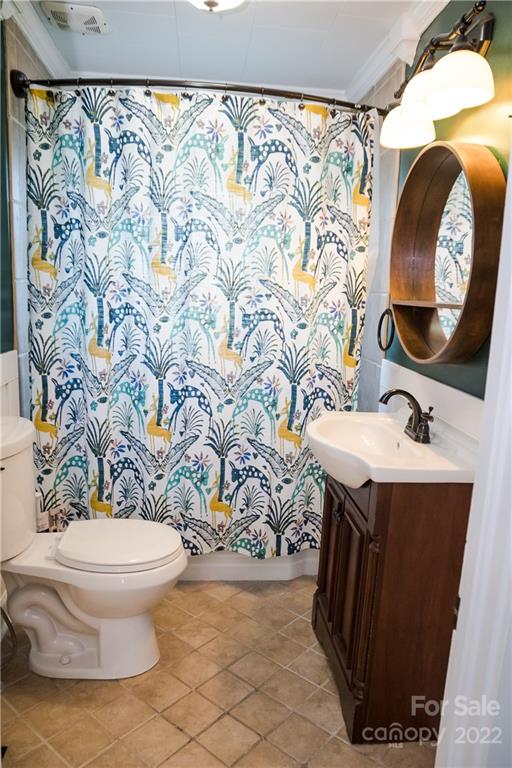 118 Baxter Street Morganton, NC 28655 - Photo 15 of 18 a bathroom with a sink toilet and mirror