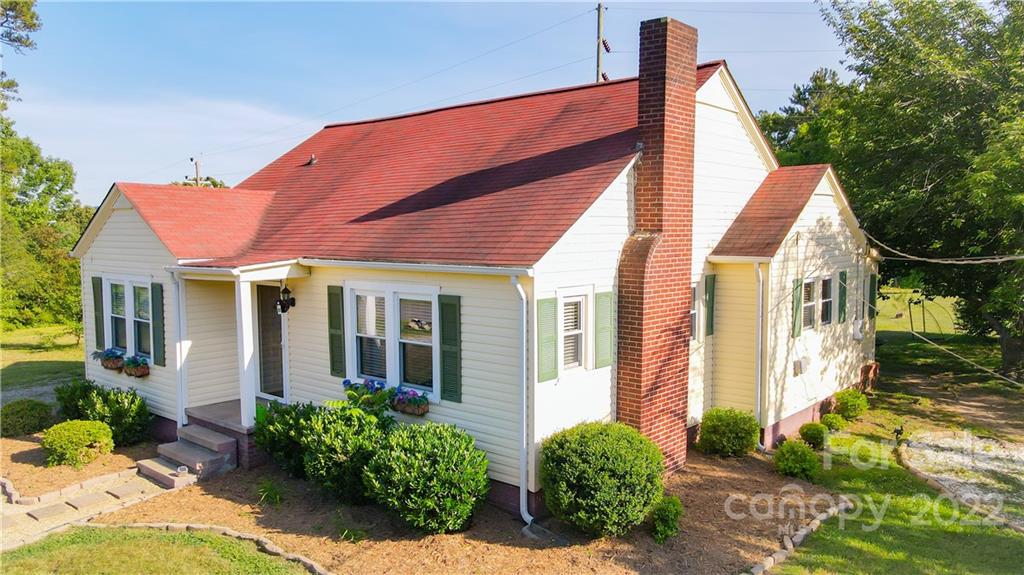 118 Baxter Street Morganton, NC 28655 - Photo 2 of 18 a view of a brick house with potted plants