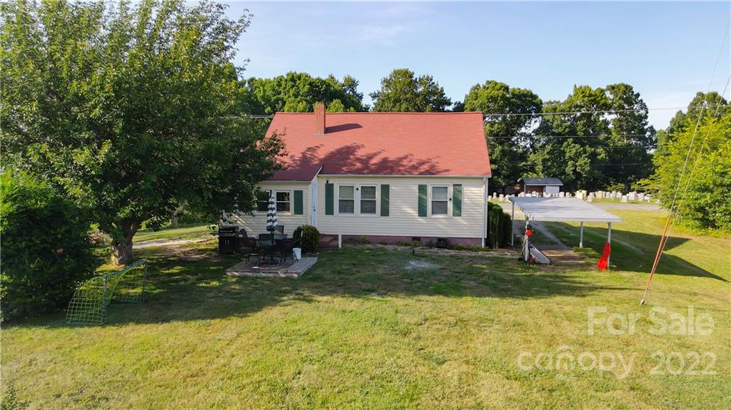 118 Baxter Street Morganton, NC 28655 - Photo 4 of 18 a view of a house with a yard and sitting area