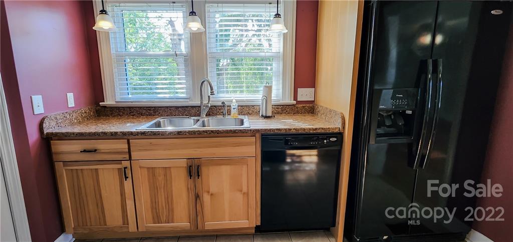 118 Baxter Street Morganton, NC 28655 - Photo 10 of 18 a kitchen with granite countertop a sink and a window