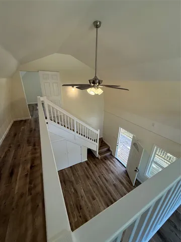 a view of an entryway with wooden floor