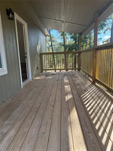 a view of balcony with wooden floor