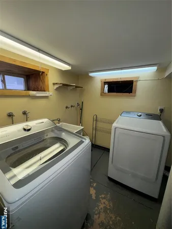 a utility room with dryer and washer