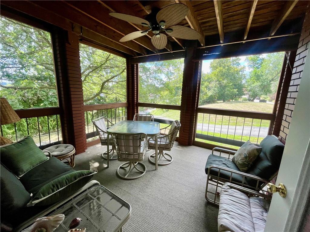 300 6th Street, Unit 10 Beaver, PA 15009 - Photo 13 of 18 a view of a dining room with furniture wooden floor and a floor to ceiling window