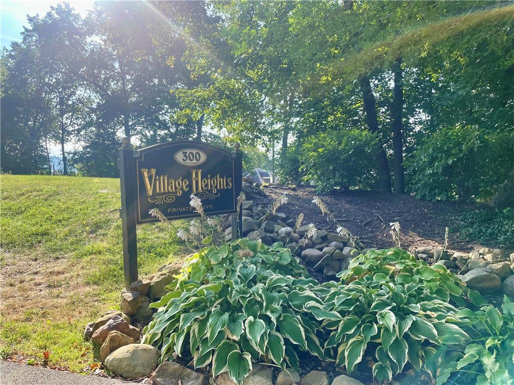 300 6th Street, Unit 10 Beaver, PA 15009 - Photo 2 of 18 a view of a garden with a tree