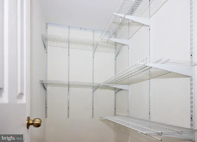a view of a room with racks on the wall