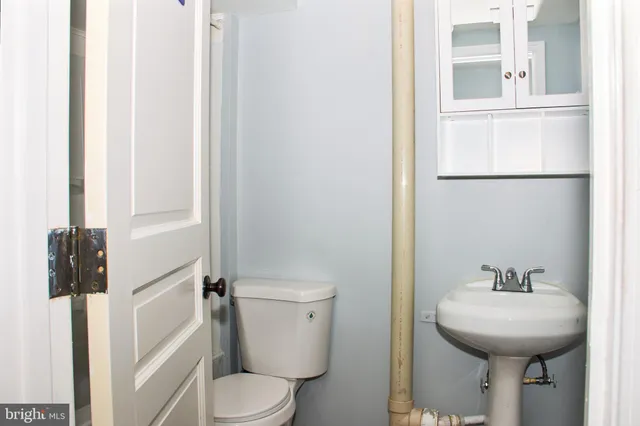 a bathroom with a sink and toilet