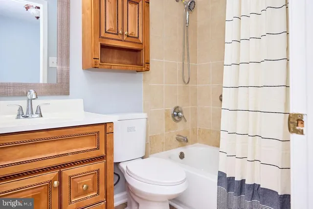 a view of a house with wooden deck